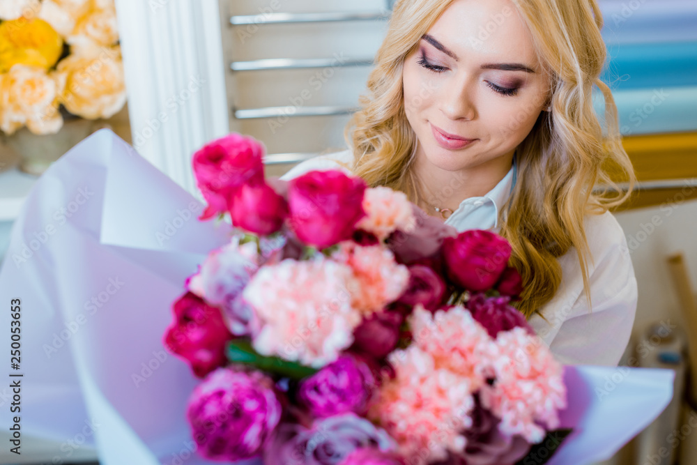 beautiful woman holding flower bouquet with roses and carnations beautiful woman holding flower bouquet with roses and carnations