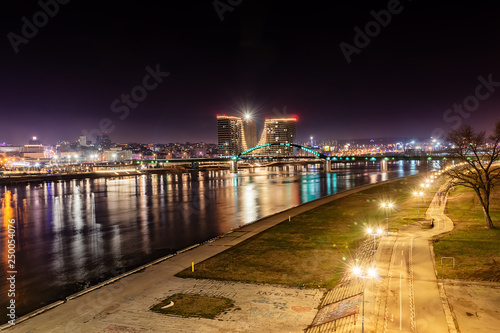 Belgrade, Serbia - February 10, 2019: A panorama of Belgrade and Sava river by night. Old Sava bridge and waterfront of Belgrade.
