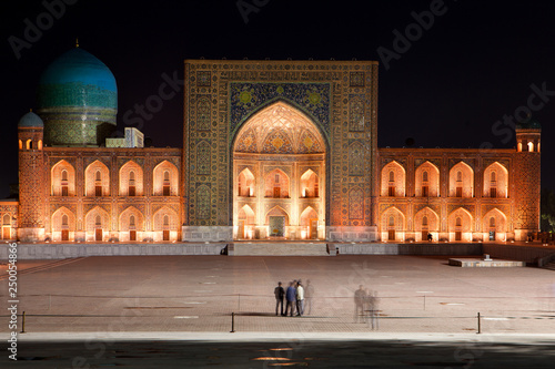 Registan Madrasah illuminated at night photo