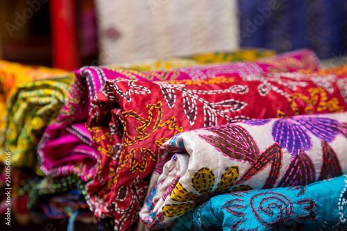Display of colorful traditional batik scarves in the art souvenir shop
