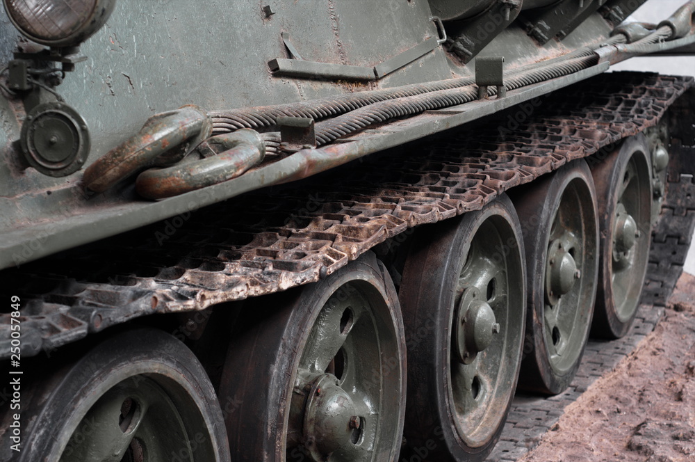 Heavy military tank tracks close up