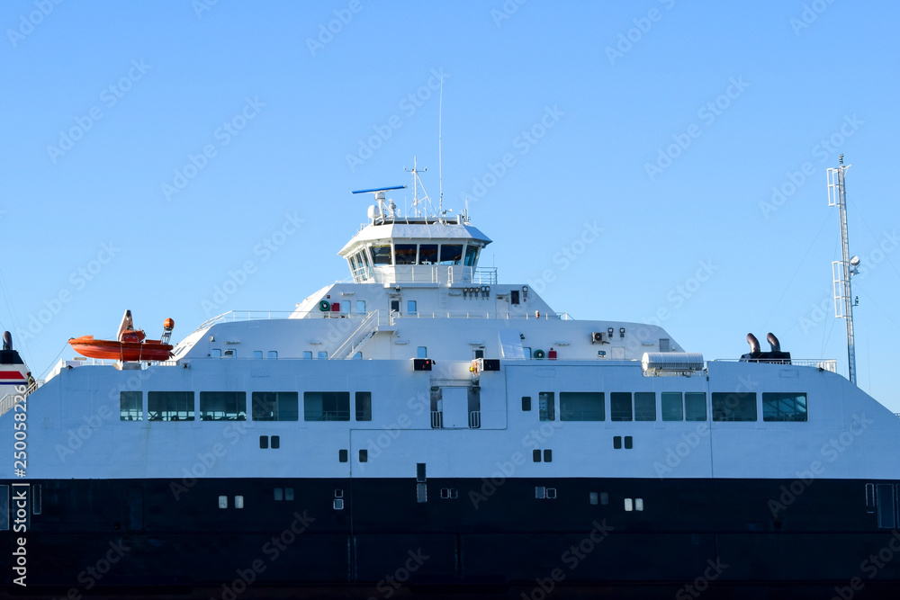 A fragment of the ferry against the blue sky. Sea transport.