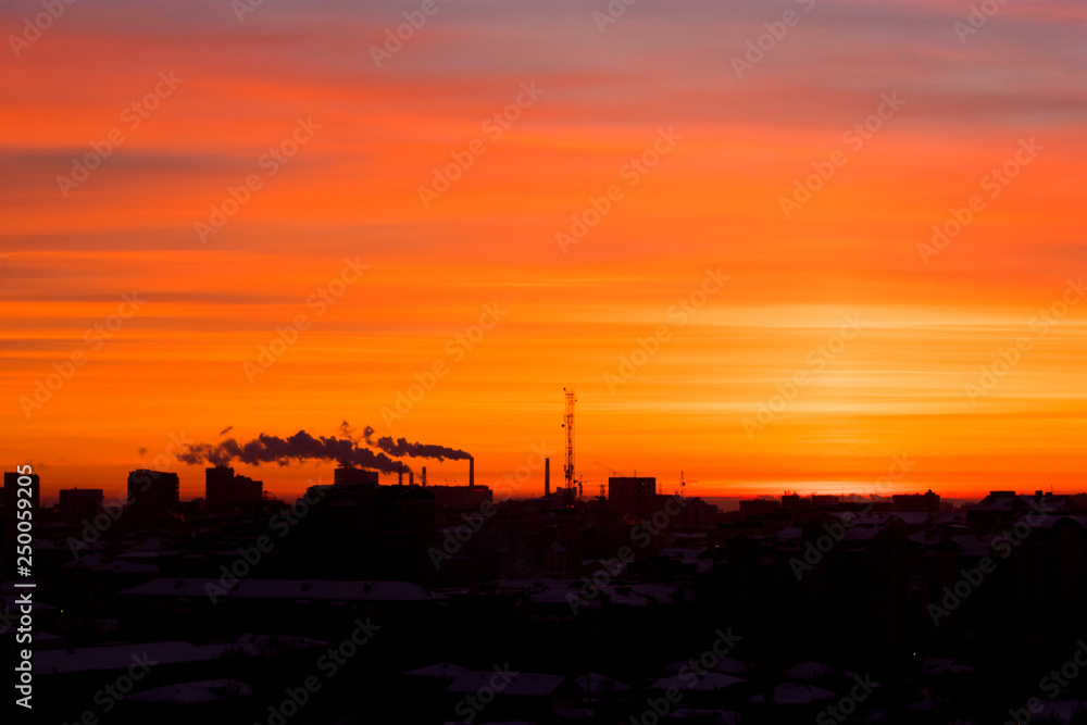 sunrise in the city with industrial pipes