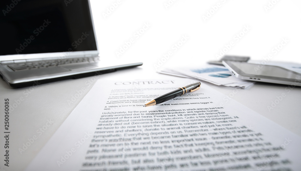 close up.sheet with the contract on the Desk