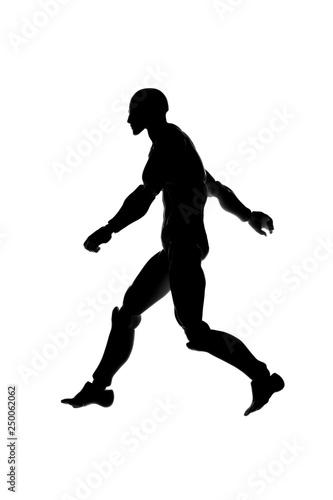 Silhouette of a walking determined man on a white background