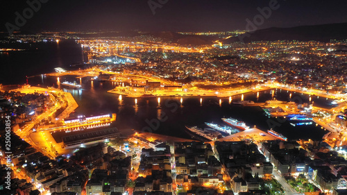 Aerial drone panoramic night shot of famous port of Piraeus one of the largest in Europe