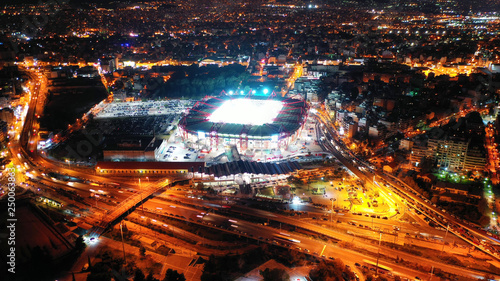 Fototapeta Naklejka Na Ścianę i Meble -  Aerial drone photo of famous illuminated football stadium of Karaiskaki in the heart of Piraeus, Attica, Greece