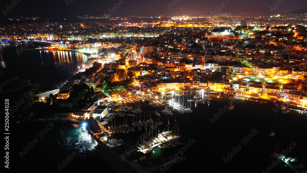 Aerial drone night shot of famous small safe port of Mikrolimano with sailboats docked, Piraeus, Attica, Greece