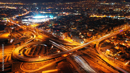 Aerial drone night shot of multilevel junction highway with moderate traffic © aerial-drone