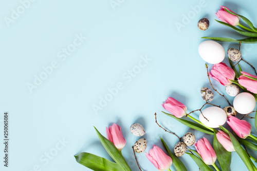 Blue background decorated with chicken and quail easter eggs