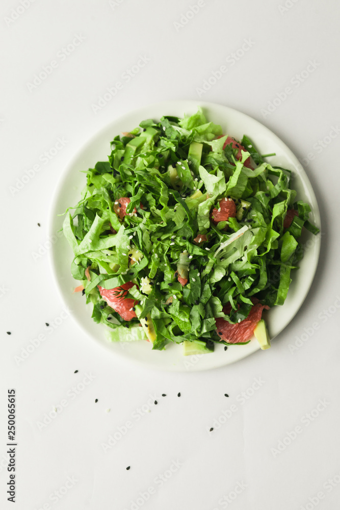 healthy vegan green salad in white bowl healthy vegan green salad in white bowl