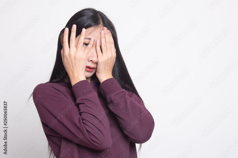 Beautiful young Asian woman peeking through fingers. Beautiful young Asian woman peeking through fingers.