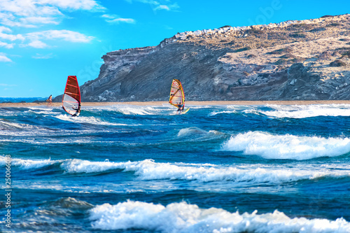 Fototapeta Naklejka Na Ścianę i Meble -  Two windsurfers surfing on Prasonisi beach (Rhodes, Greece)