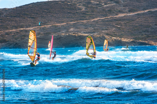 Windsurfers and kitesurfers ride on Prasonisi beach (Rhodes, Greece)