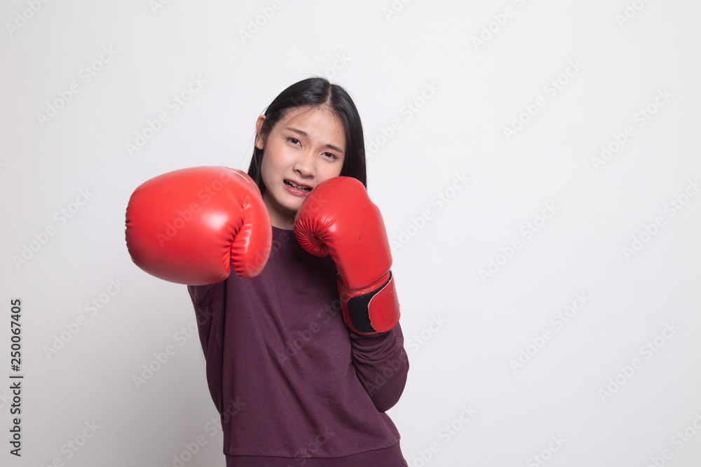 Young Asian woman with red boxing gloves. Young Asian woman with red boxing gloves.