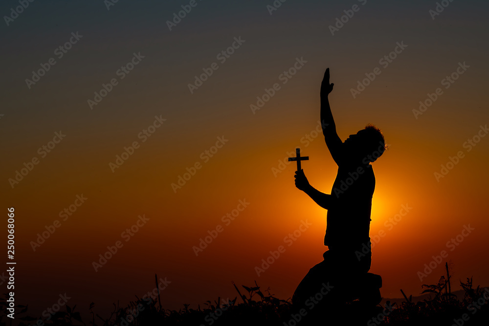 The human hand holds cross a christian religion faith concept