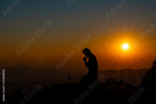 Symbol of God love to people the mountain at sunset