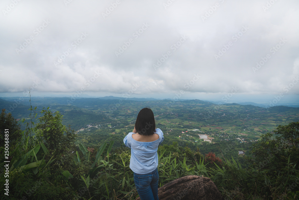 Happy young cute Asian Japanese girl hipster backpack photography women taking a photo at beautiful sky mountains scenery views 