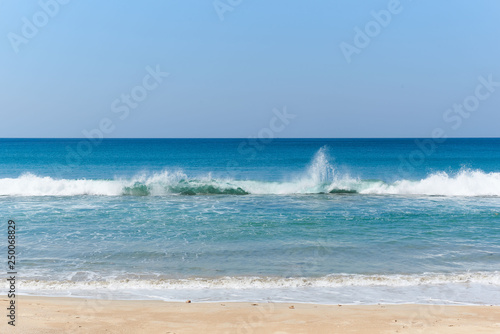 Background of clear blue sky and sea waves