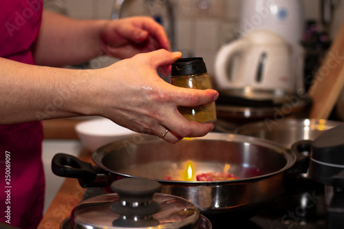 cook preparing lamb soup with vegetables in the kitchen