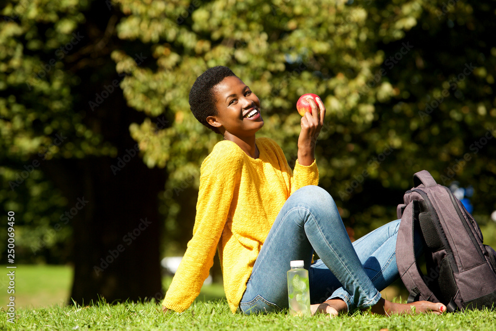 healthy young woman with apple in park healthy young woman with apple in park