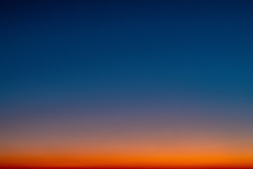 Sky gradient from blue to orange sunset