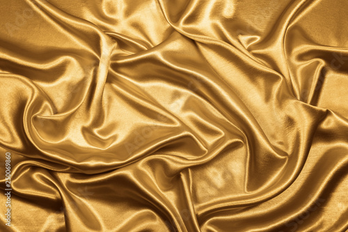 Gold luxury satin fabric texture for background