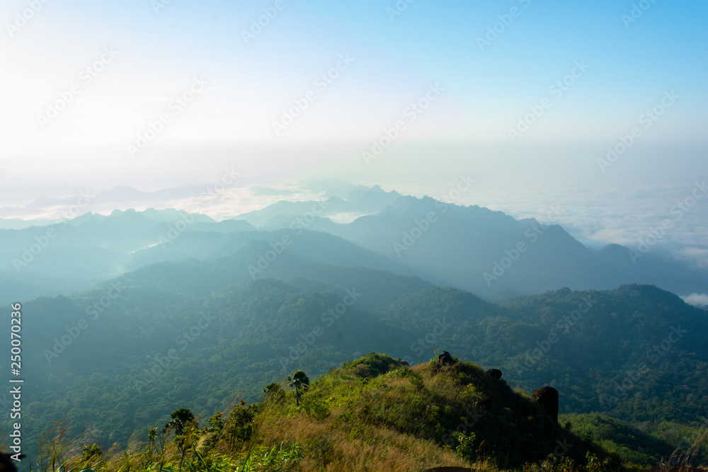 man stand on the stone top of the mountain at Kanchanaburi, Thailand man stand on the stone top of the mountain at Kanchanaburi, Thailand