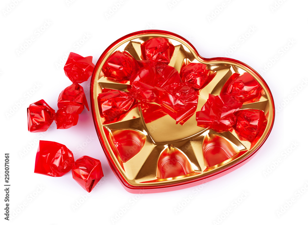 Fototapeta premium Chocolate candy in a heart-shaped box for Valentine's Day on a white background