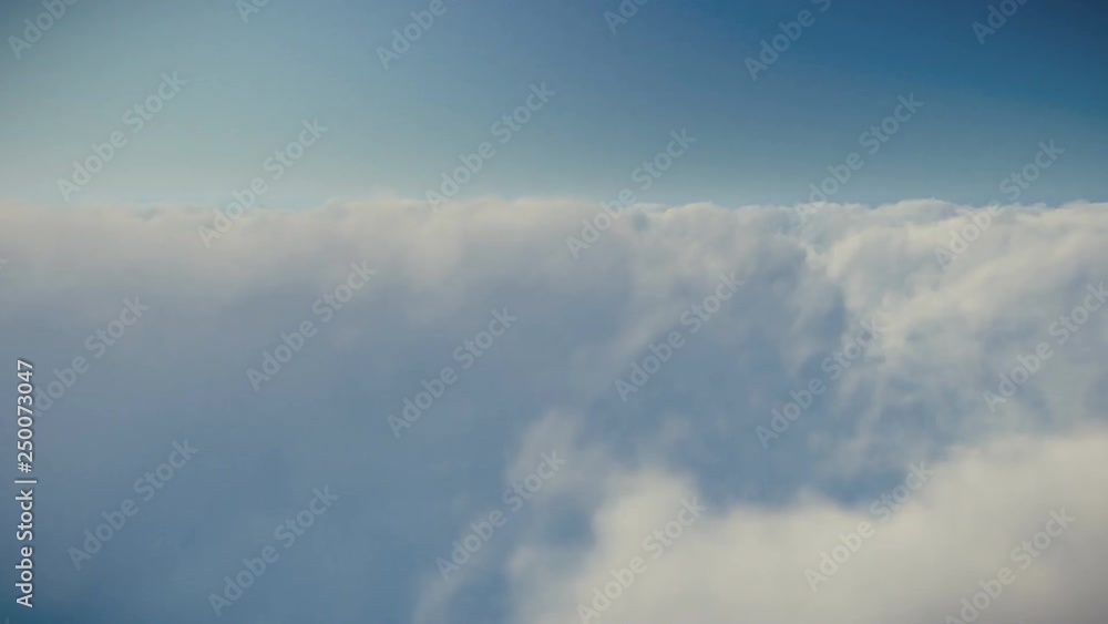Flight above clouds against blue sky, 4K Flight above clouds against blue sky, 4K