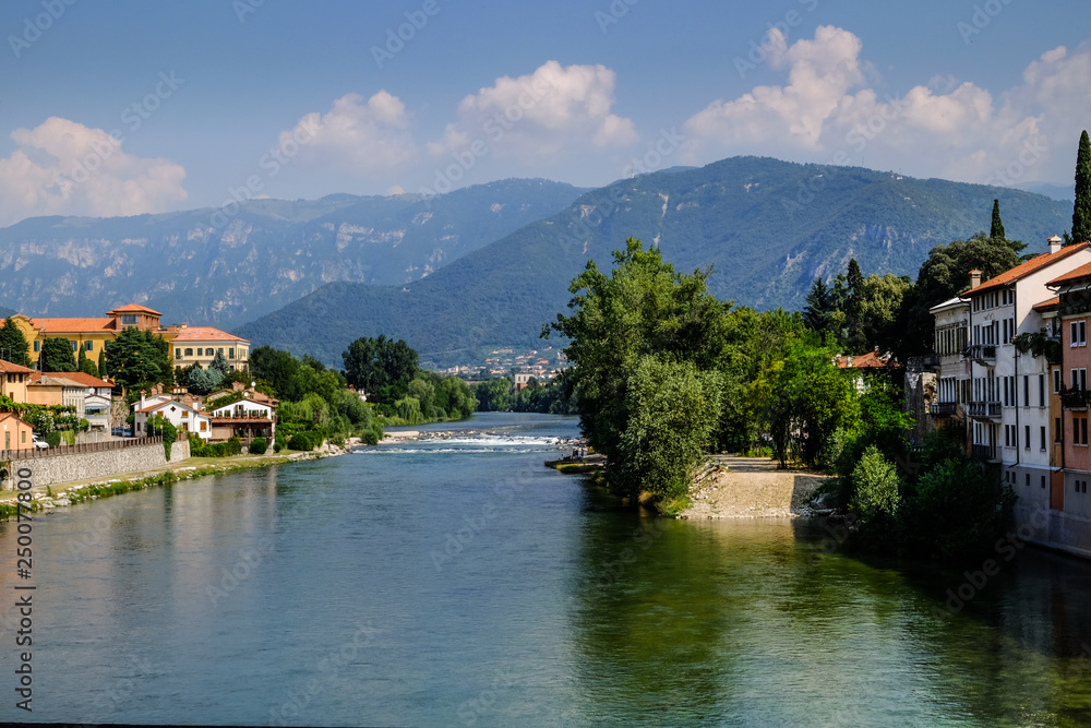 Brenta River and the Alpi Mountains. Bassano del Grappa, Vicenza, Veneto, Italy. 9th August 2019