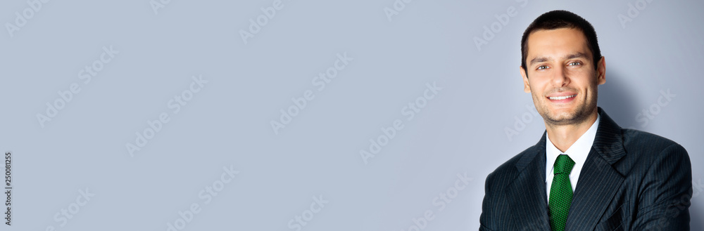 Happy businessman with crossed arms, on grey Happy businessman with crossed arms, on grey