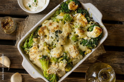 Baked gratin of cauliflower, broccoli and romanesco with cream and mustard sauce