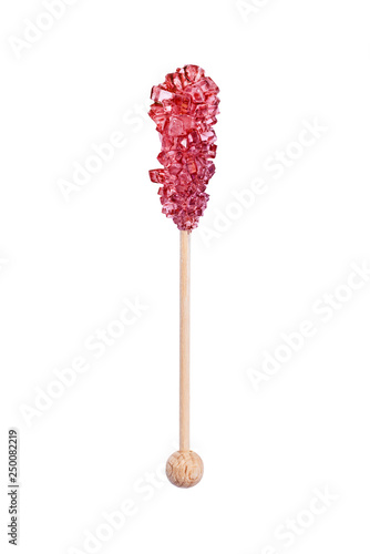 Rock candy or red sugar candy isolated on white background. Crystallized sugar. Nabat or rock candy is often used as a type of candy, or used to sweeten milk, or dissolved in tea. photo