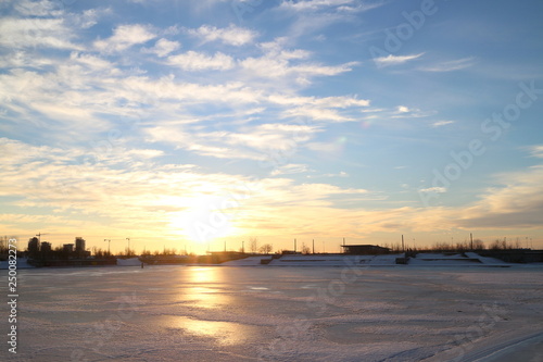 sunsets on city pond in winter © Andrey