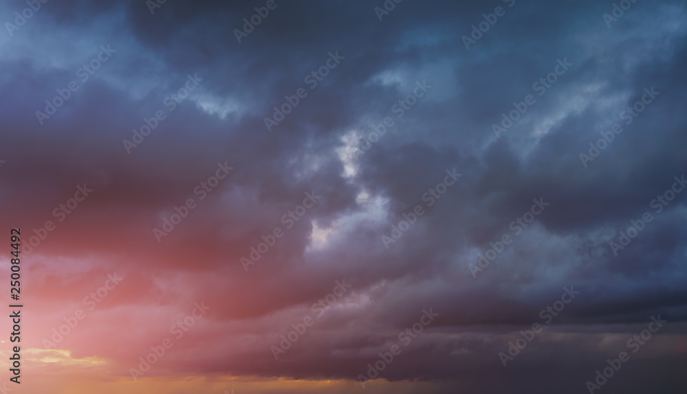 background of cloudy dark sky at sunset