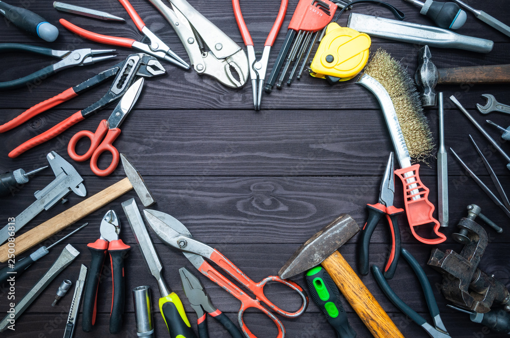 Tool and heart on dark wooden background. Love for your work, Father's Day. Tool and heart on dark wooden background. Love for your work, Father's Day.