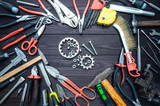Tool gears and heart on dark wooden background. Love for your work, Father's Day.