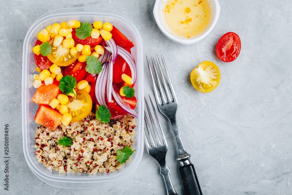 Healthy vegan meal prep containers with quinoa and fresh vegetables Healthy vegan meal prep containers with quinoa and fresh vegetables