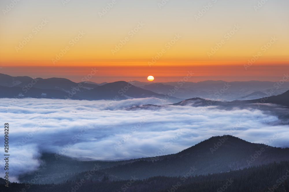 Winter mountain valleys with magical nature in the Ukrainian Carpathian Mountains with hazy dawns and fantastic evenings overlooking the snow-capped winter peaks. Winter mountain valleys with magical nature in the Ukrainian Carpathian Mountains with hazy dawns and fantastic evenings overlooking the snow-capped winter peaks.