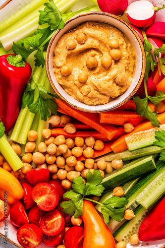 Hummus with various fresh raw vegetables.
