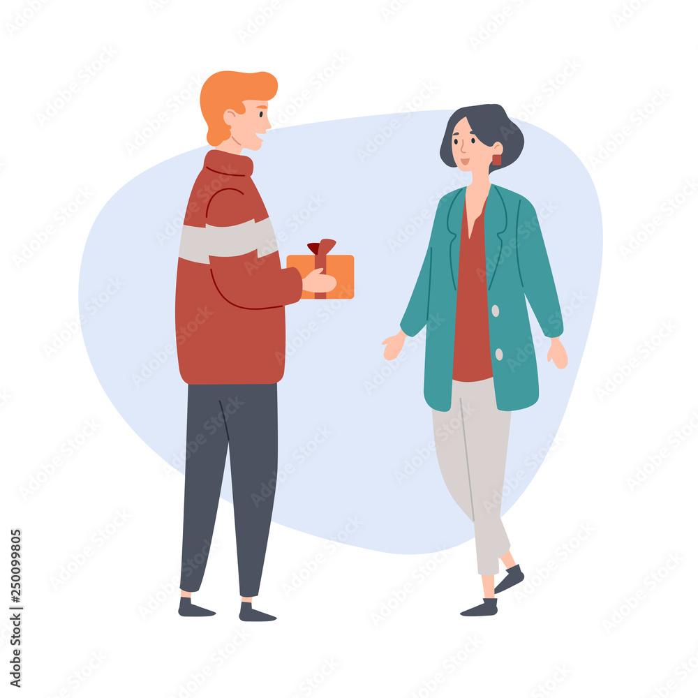 Fototapeta premium Young man gives a gift to his girlfriend. Congratulation, celebration, love, relationship.