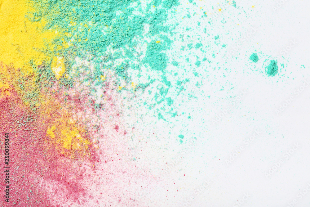 Colorful holi powders on white background