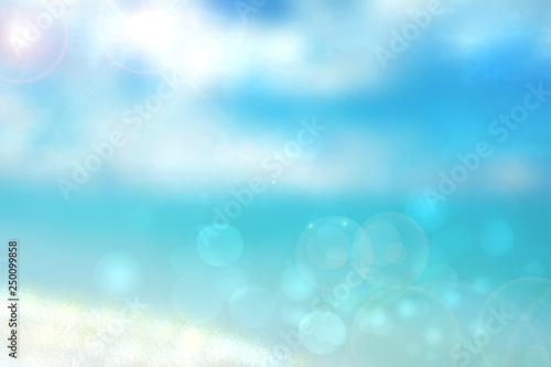 Abstract beach background. Abstract bright tropical sand beach with sun and blue cloudy sky and waves on ocean. Backdrop for summer holidays and travel advertising.