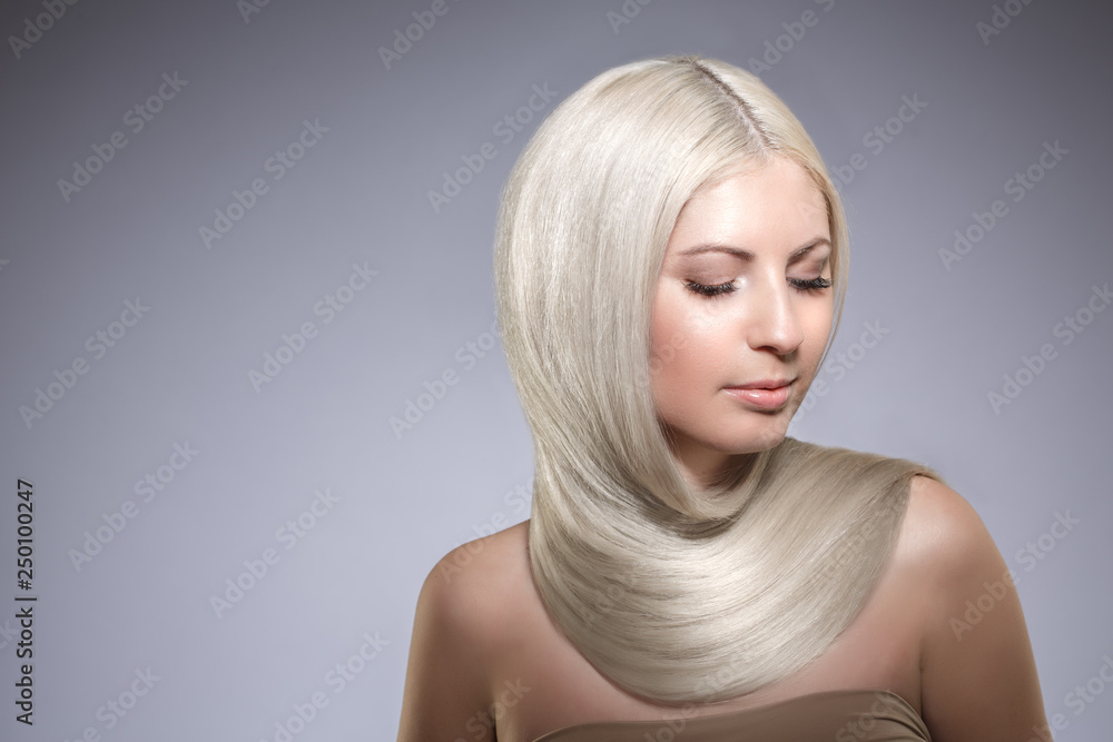 Model blonde with long healthy shiny hair. Woman wearing hair Model blonde with long healthy shiny hair. Woman wearing hair