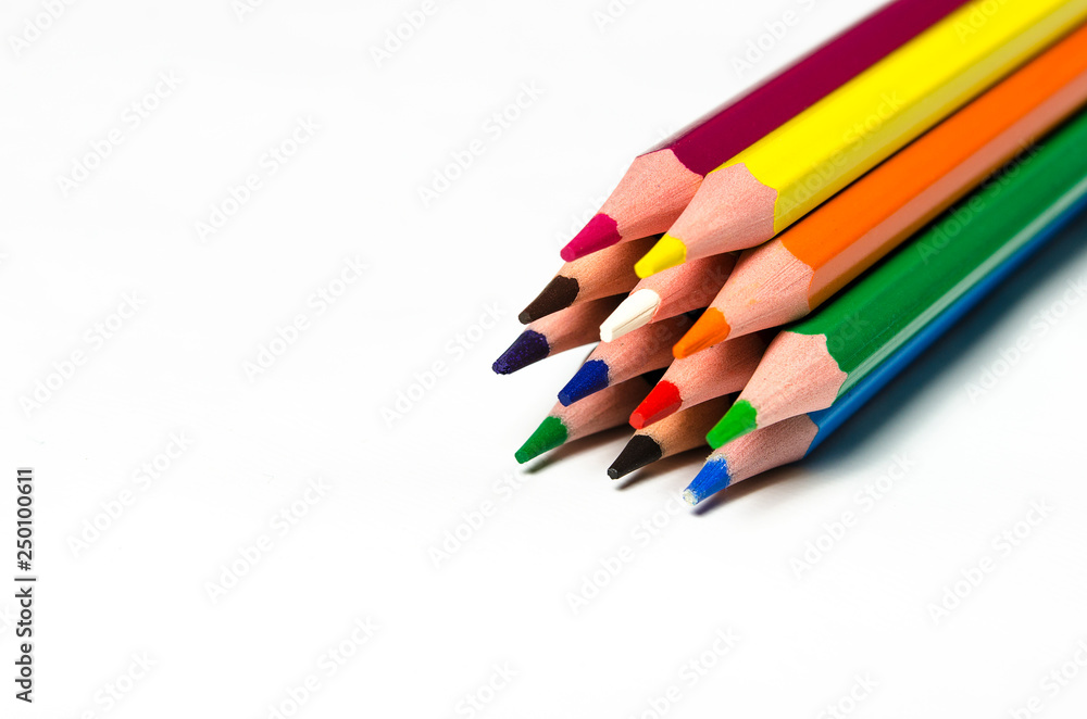 Colourful sharp pencils lie on a white background Colourful sharp pencils lie on a white background