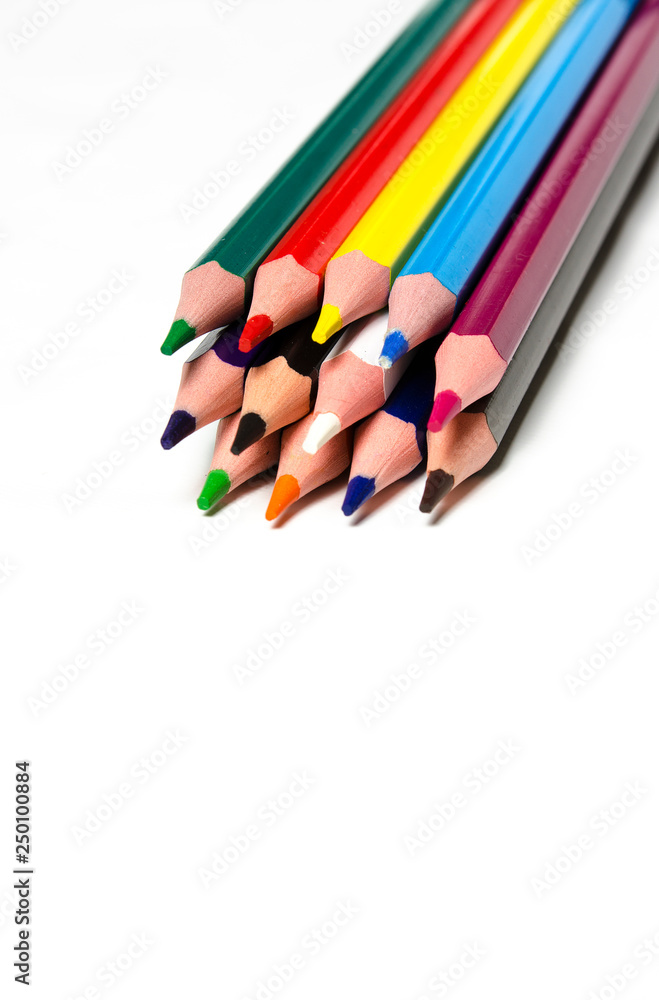 Fototapeta premium Colourful sharp pencils lie on a white background