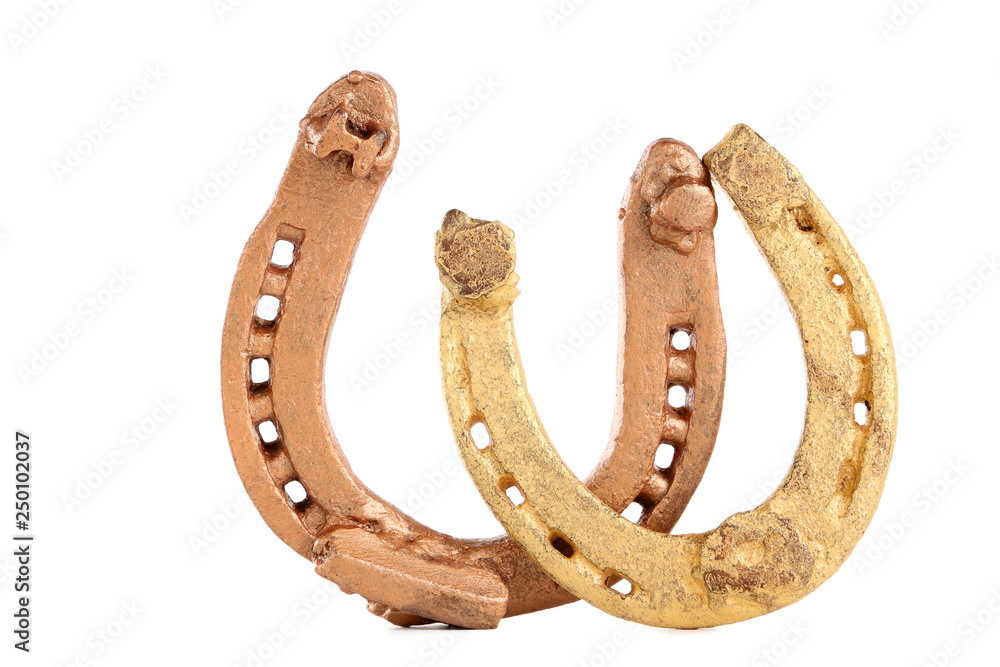 St.Patrick's Day. Golden horseshoes isolated on white background St.Patrick's Day. Golden horseshoes isolated on white background