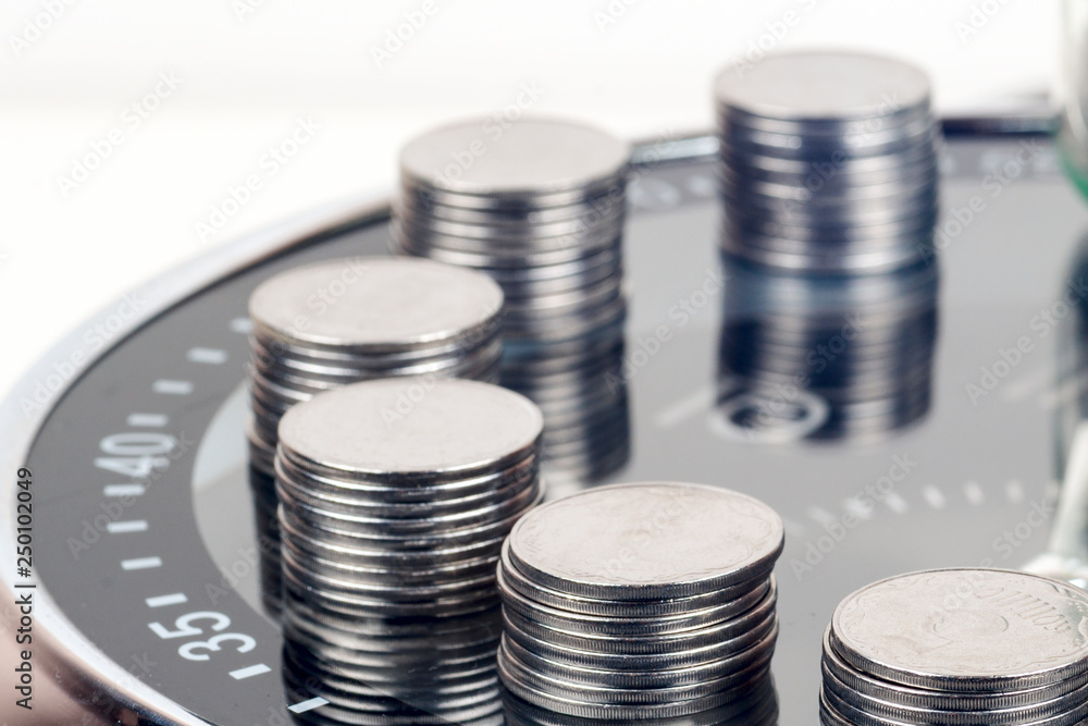 coins with plant and clock, isolated on white background. savings concept coins with plant and clock, isolated on white background. savings concept