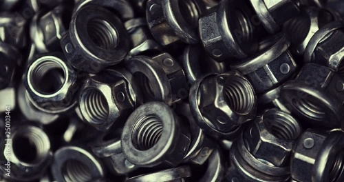 Background of the steel nuts on the bolts in close view.
